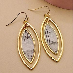 Ivory Leaf earrings with natural cork gold flecks that looks like a teardrops